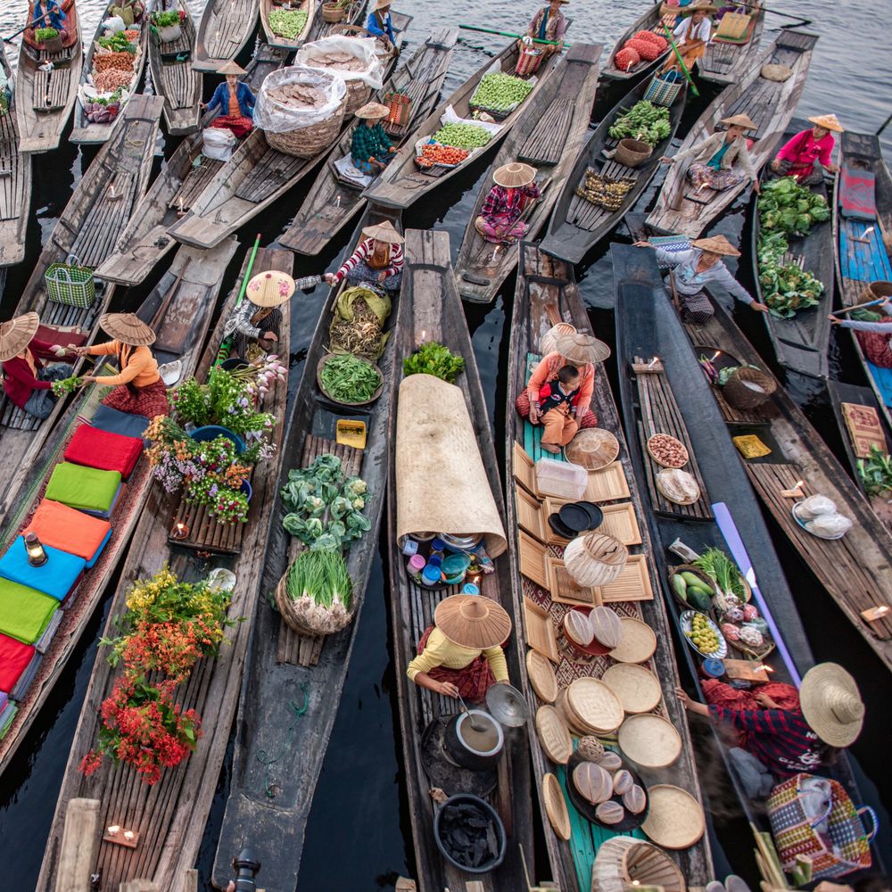 Floating market boats laden with fresh produce on Inle Lake