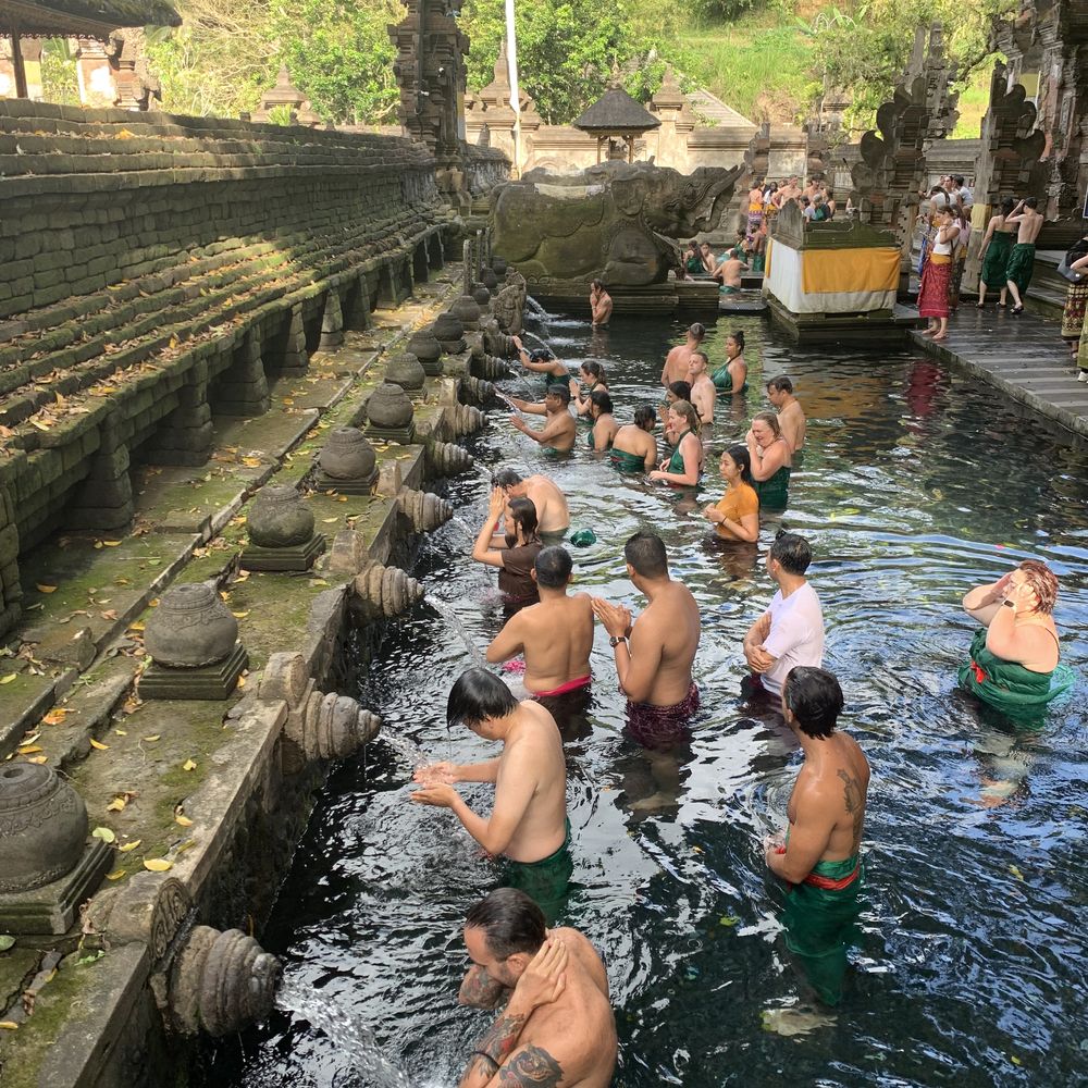 Worshippers bathing in the holy spring pools of Tirta Empul, Bali